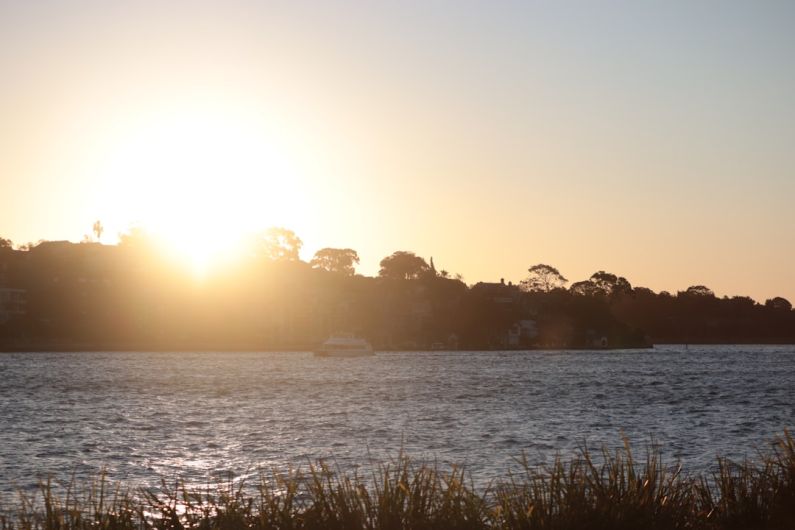 Barangaroo Reserve - a body of water with a boat in the distance